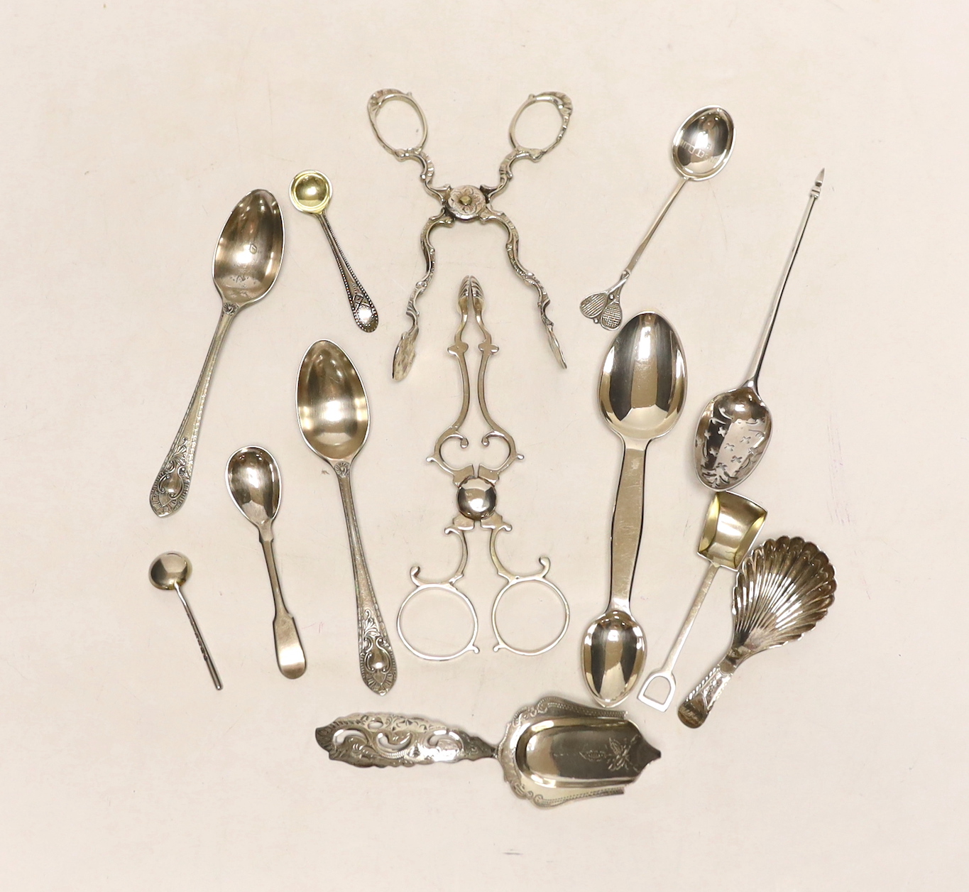 A small quantity of assorted silver flatware etc. including spoons, caddy spoon, condiment spoons, 18th century mote spoon and two pairs of sugar nips.